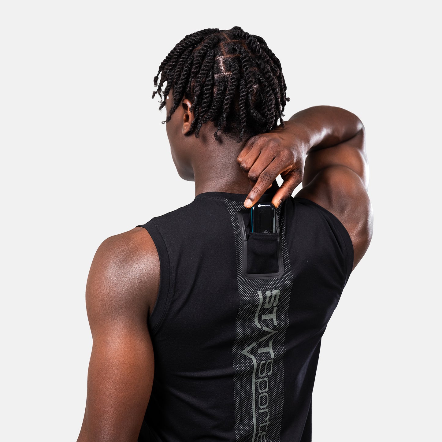 Black STATSports sleeveless baselayer, rear view with hand near the pod pocket