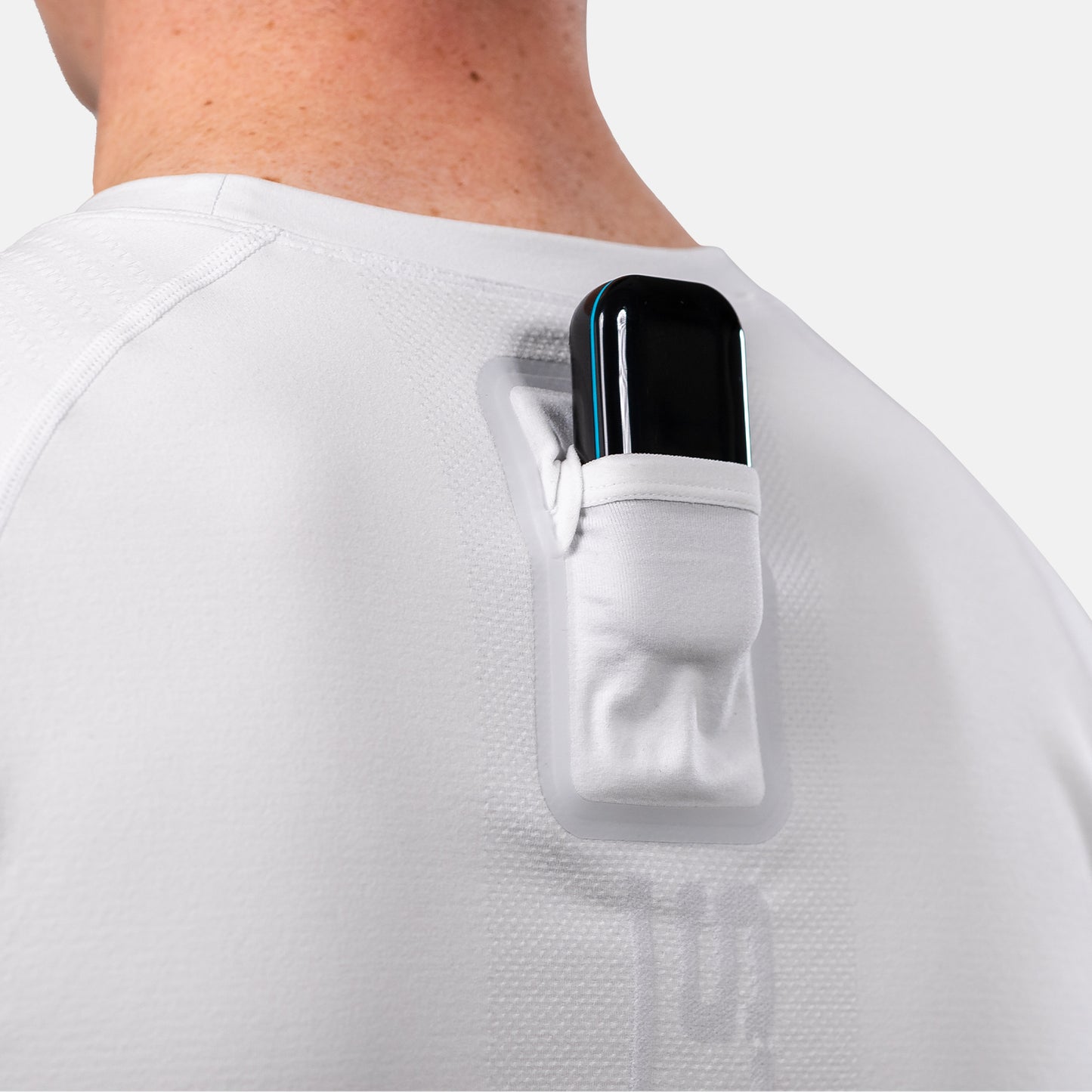 Close-up of the rear GPS pod pocket on the white STATSports short sleeve baselayer