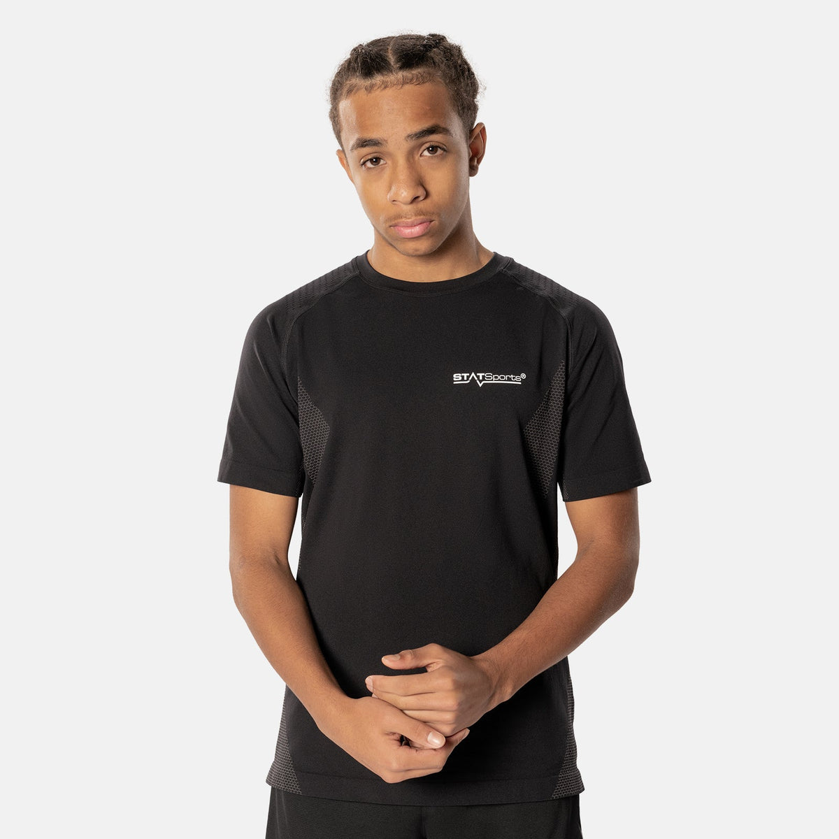 Man wearing the black STATSports short sleeve baselayer, side view