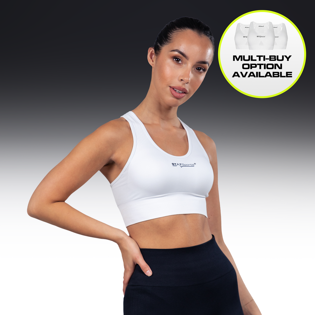 Woman wearing the white STATSports Women's Performance Sports Bra, front view