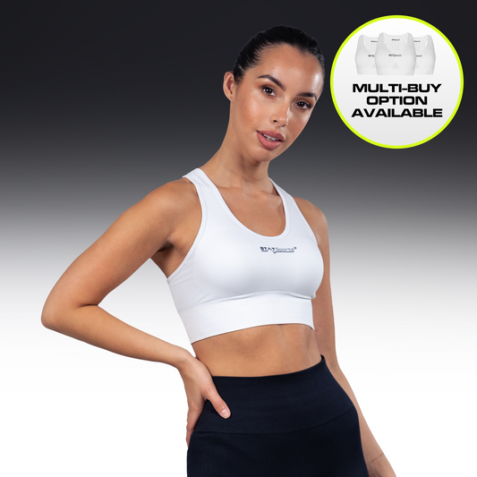 Woman wearing the white STATSports Women's Performance Sports Bra, front view