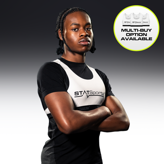 Athlete wearing the white STATSports GPS vest over a black shirt, arms folded